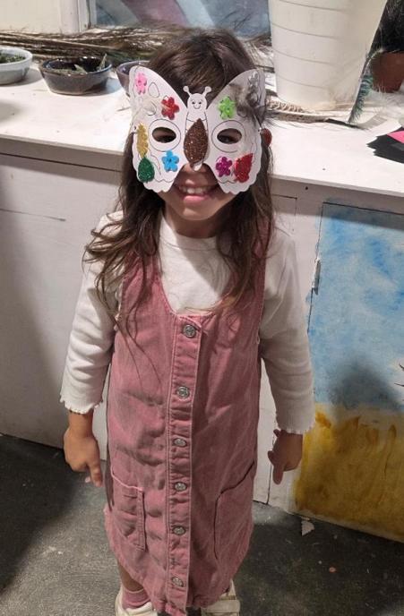 Child wearing home made mask.