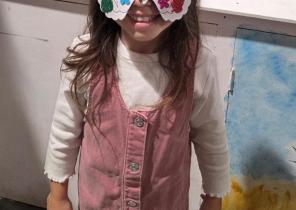 Child wearing home made mask.